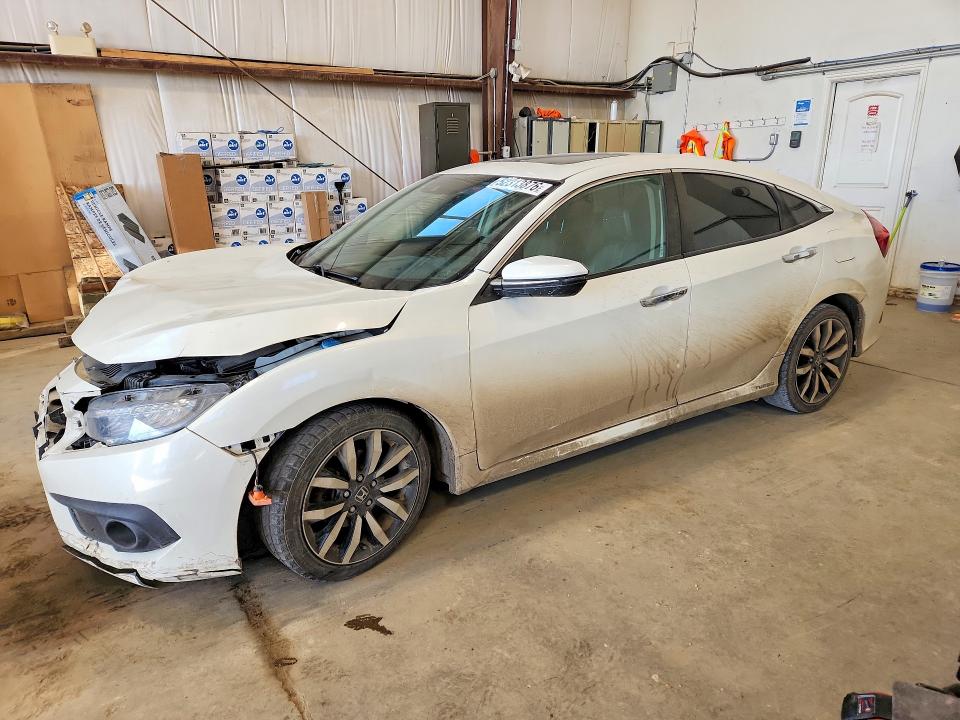 Auction sale of the 2017 Honda Civic Touring 4dr, vin: 2HGFC1F98HH102202, lot number: 52313876