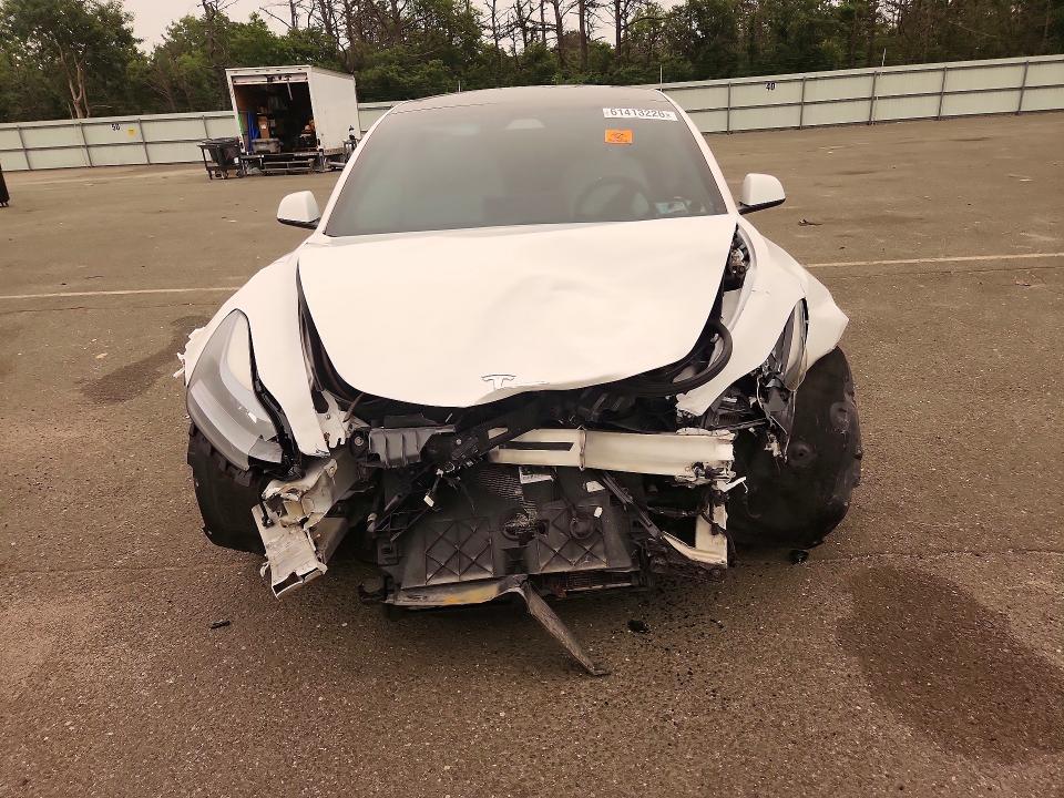 Продажа на аукционе авто 2021 Tesla Model 3, vin: 5YJ3E1EA4MF915950, номер лота: 61413226