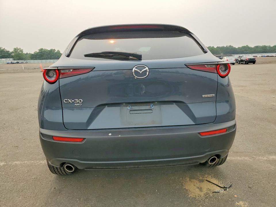 61030016 :رقم المزاد ، 3MVDMBCM7PM569451 vin ، 2023 Mazda Cx-30 مزاد بيع