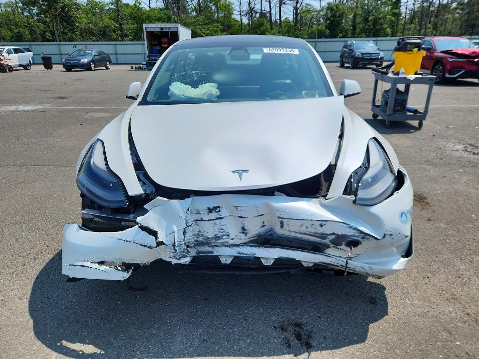 62009356 :رقم المزاد ، 5YJ3E1EB4MF051037 vin ، 2021 Tesla Model 3 مزاد بيع