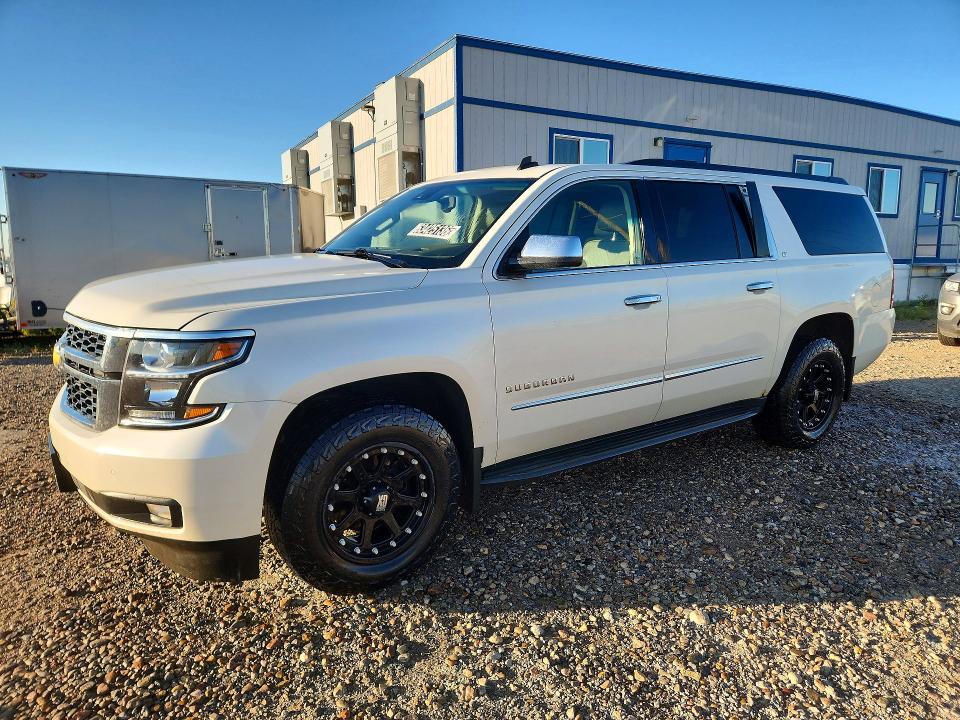 Auction sale of the 2015 Chevrolet Suburban, vin: 1GNSKJKC1FR142191, lot number: 63425136