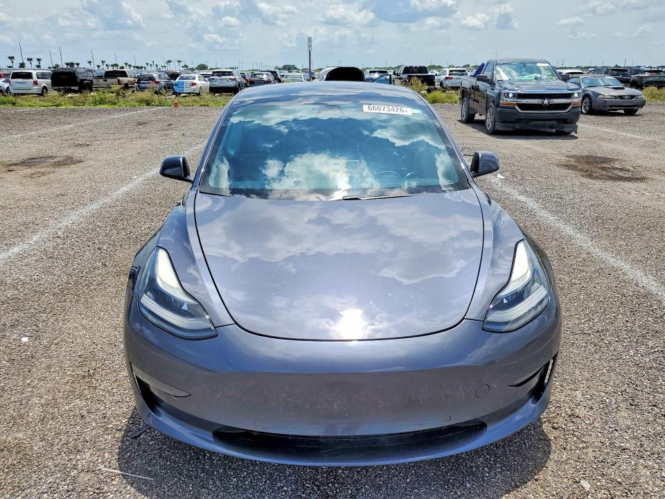 Продажа на аукционе авто 2021 Tesla Model 3, vin: 5YJ3E1EAXMF083076, номер лота: 66073426