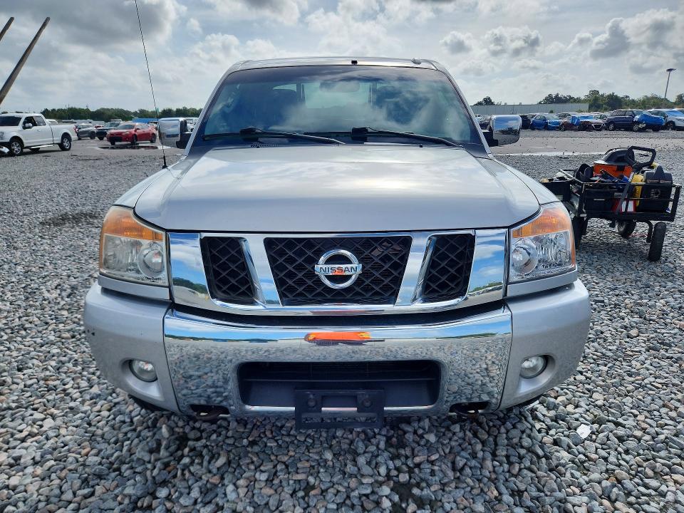 69103206 :رقم المزاد ، 1N6BA0EC0AN310286 vin ، 2010 Nissan Titan مزاد بيع