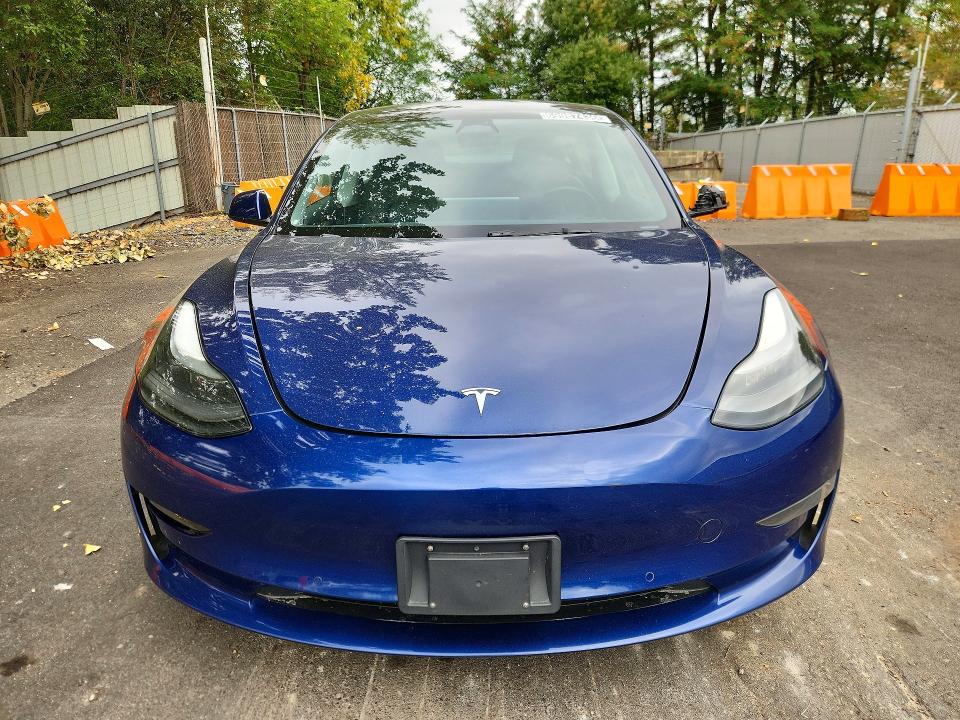 Продажа на аукционе авто 2022 Tesla Model 3, vin: 5YJ3E1EA1NF303884, номер лота: 69987436
